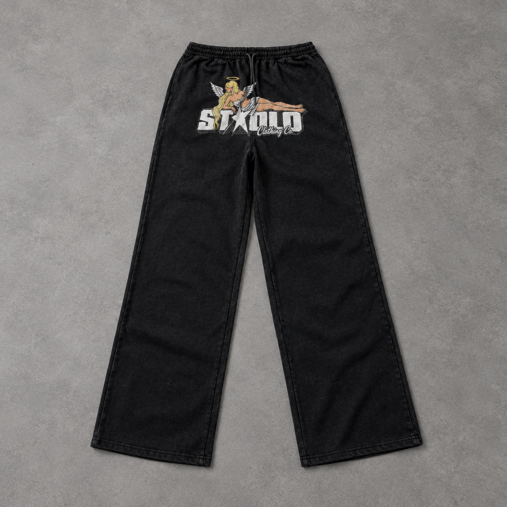 Angel graphic pants on grey studio floor