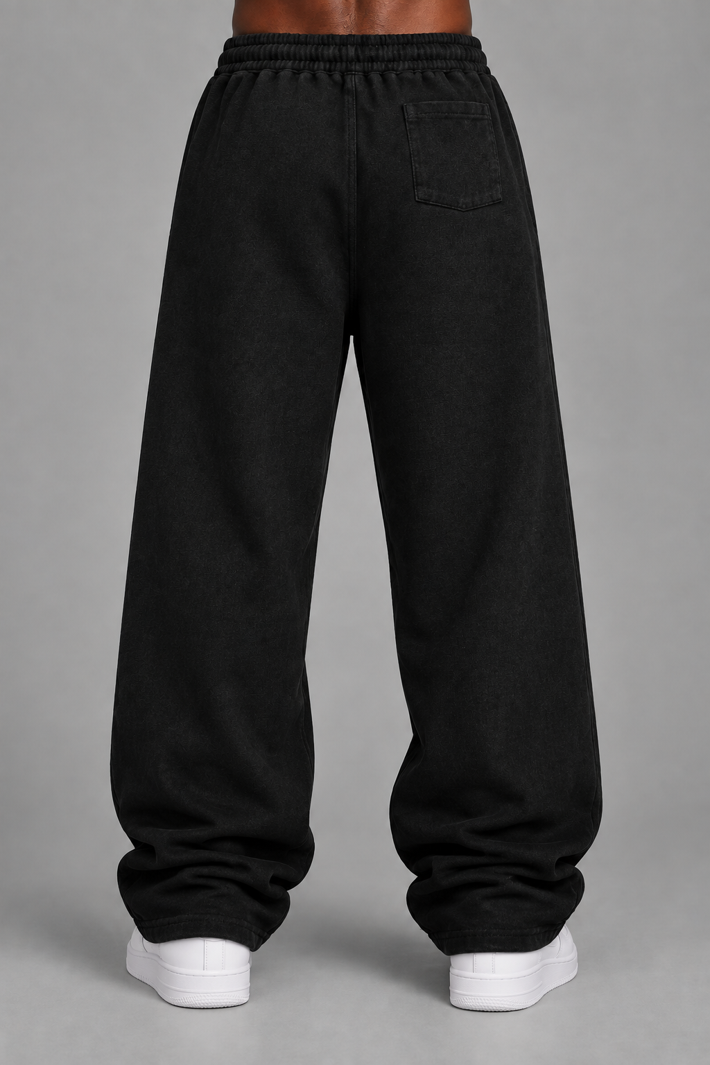 Back-view sweatpants product photo in a grey studio