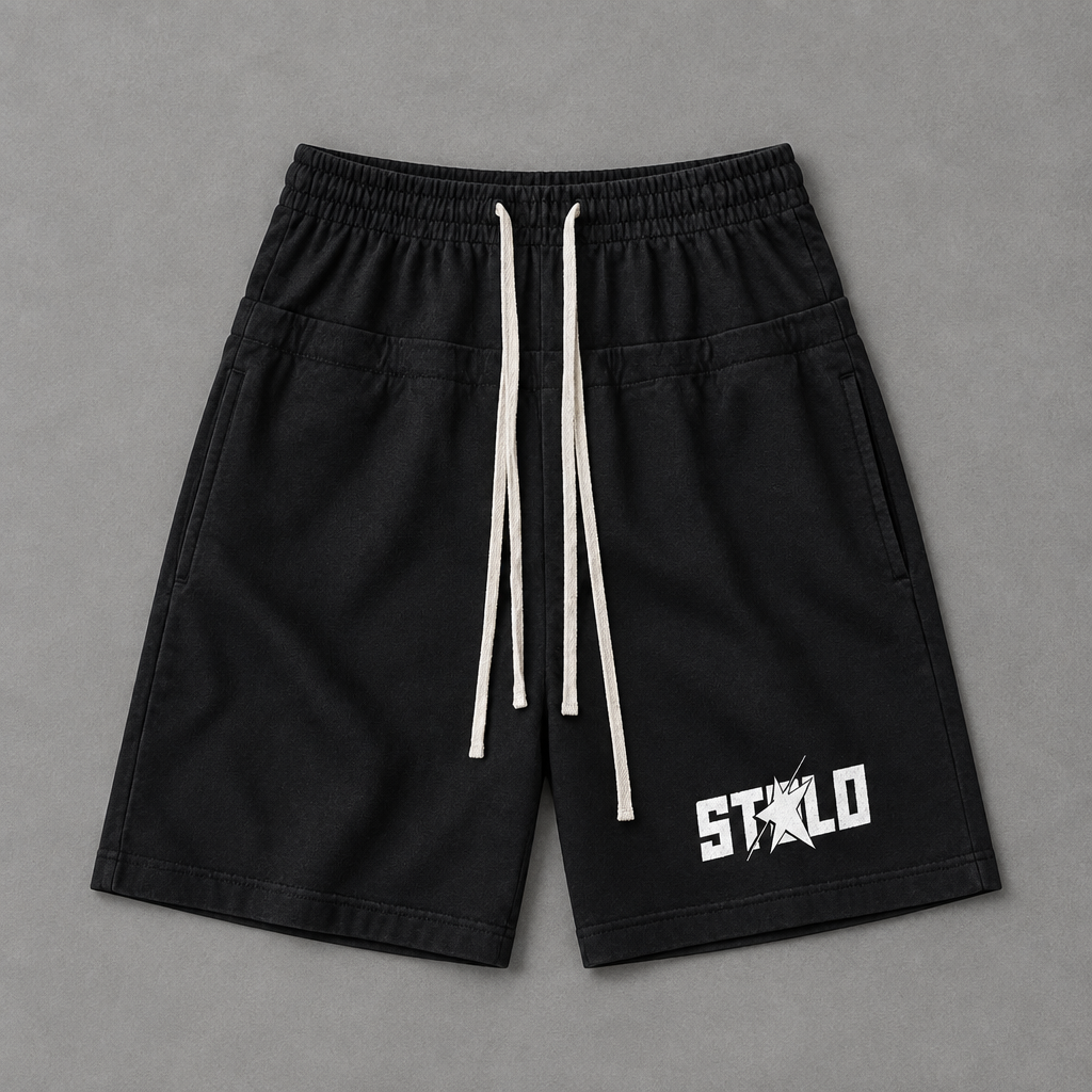 Black shorts on grey floor
