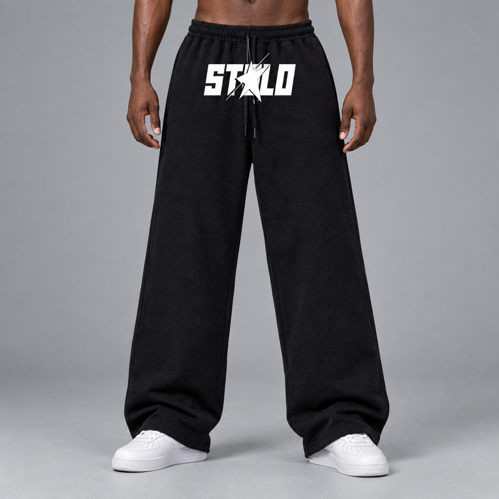 Black STOLO wide-leg pants on a dark-skinned male model with white Air Force Ones, square product-card shot