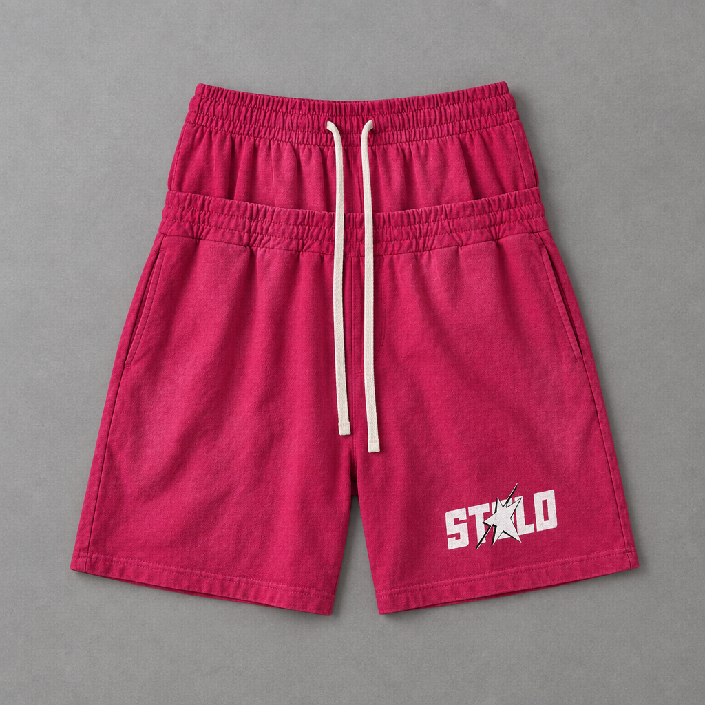 Bright pink shorts on grey floor
