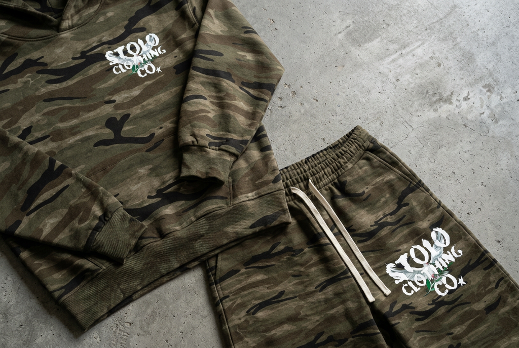 Camo set fabric, logos, and waistband floor detail
