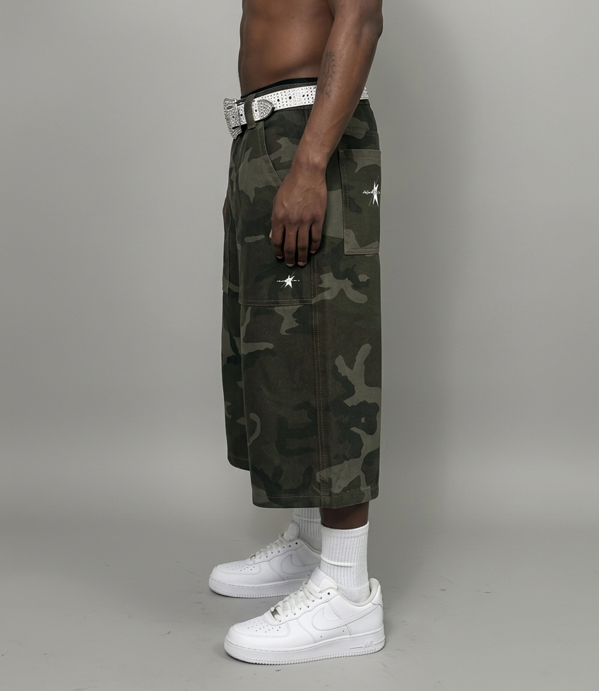 Camo shorts side view with white rhinestone belt, white socks and shoes