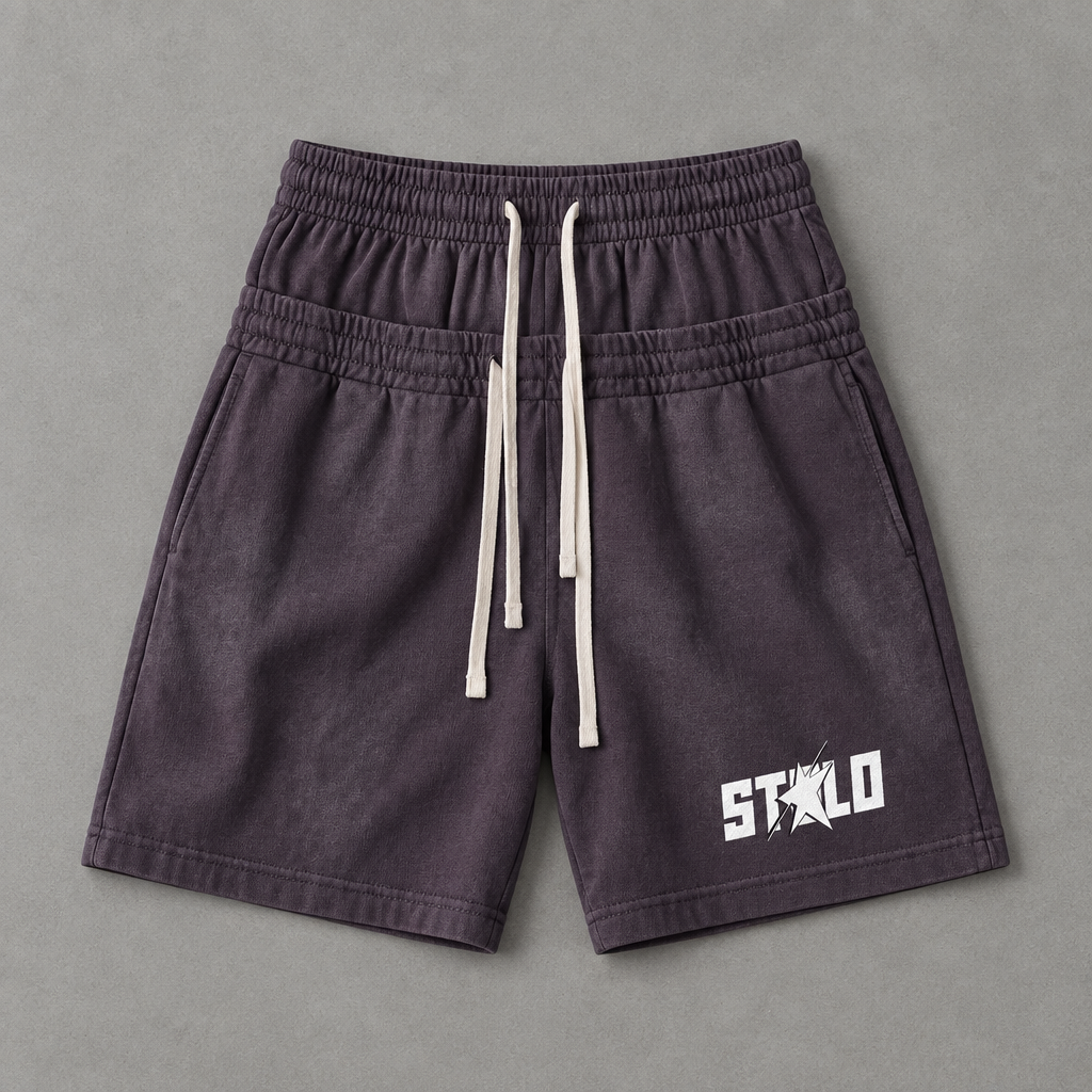 Dark purple shorts on grey floor