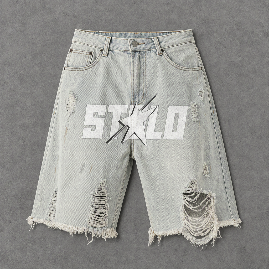Front of light distressed denim shorts on grey studio floor