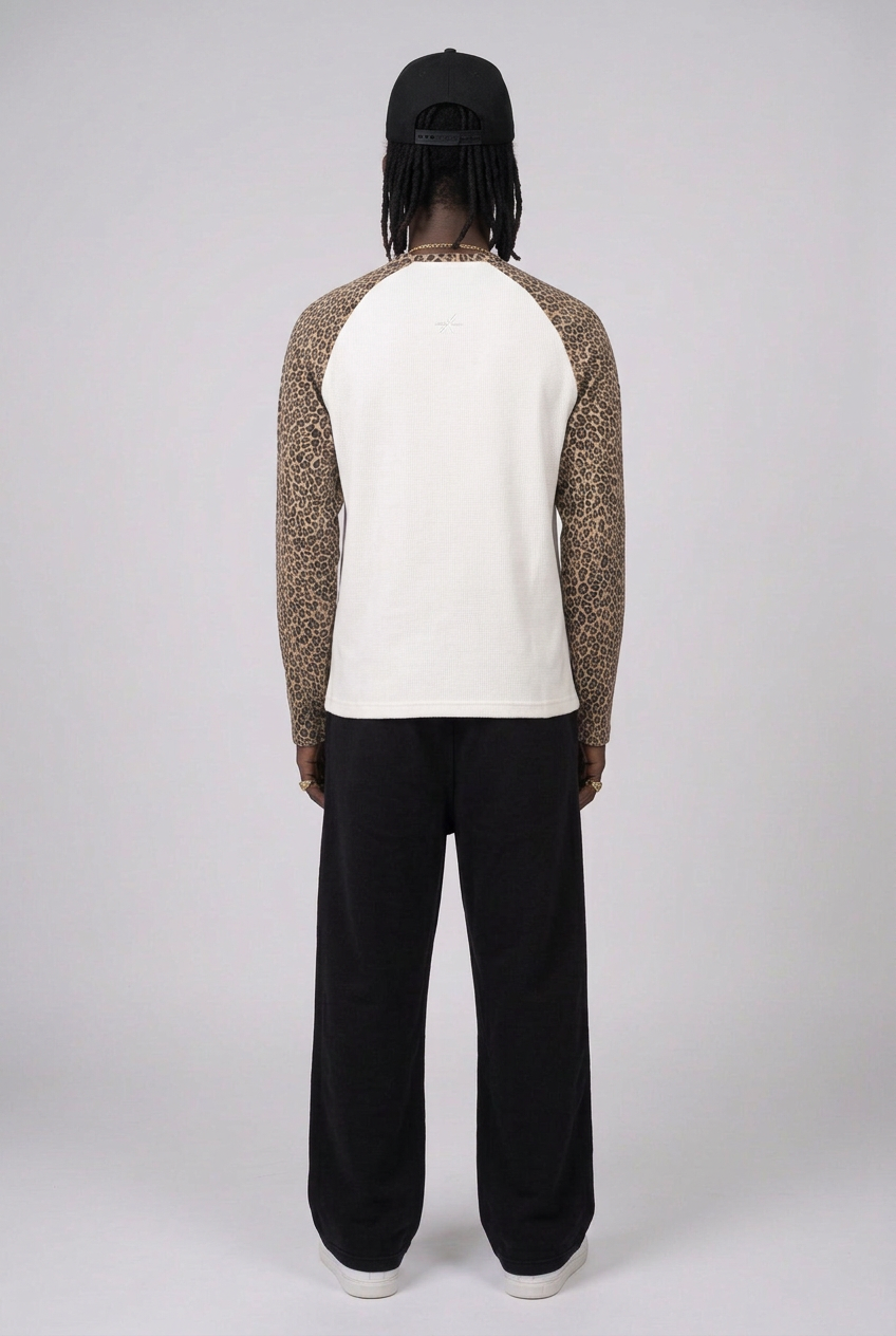 Full-body back view in leopard-sleeve tee and REBORN sweats