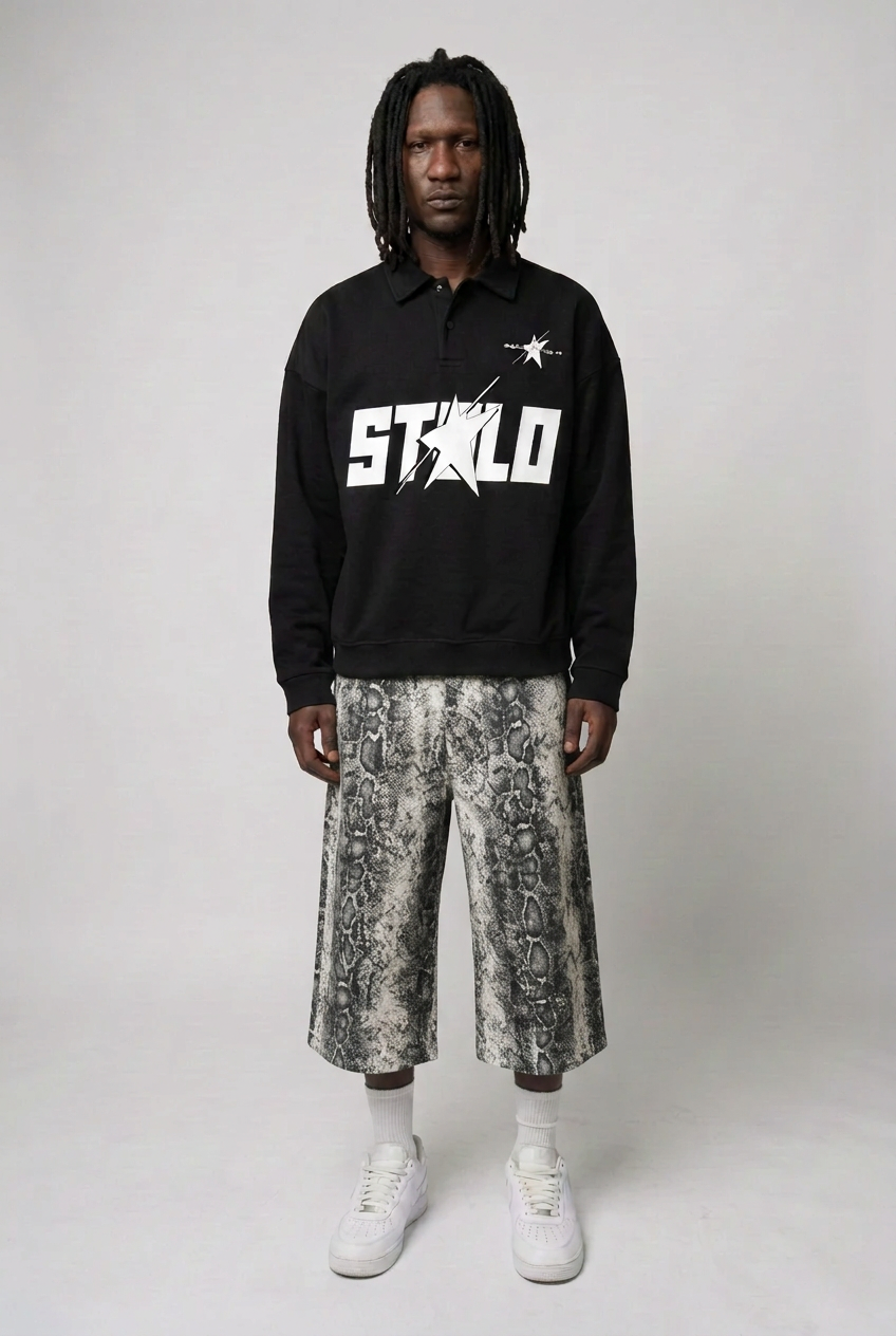Male model wearing the heavyweight half-zip polo and snake-print jorts