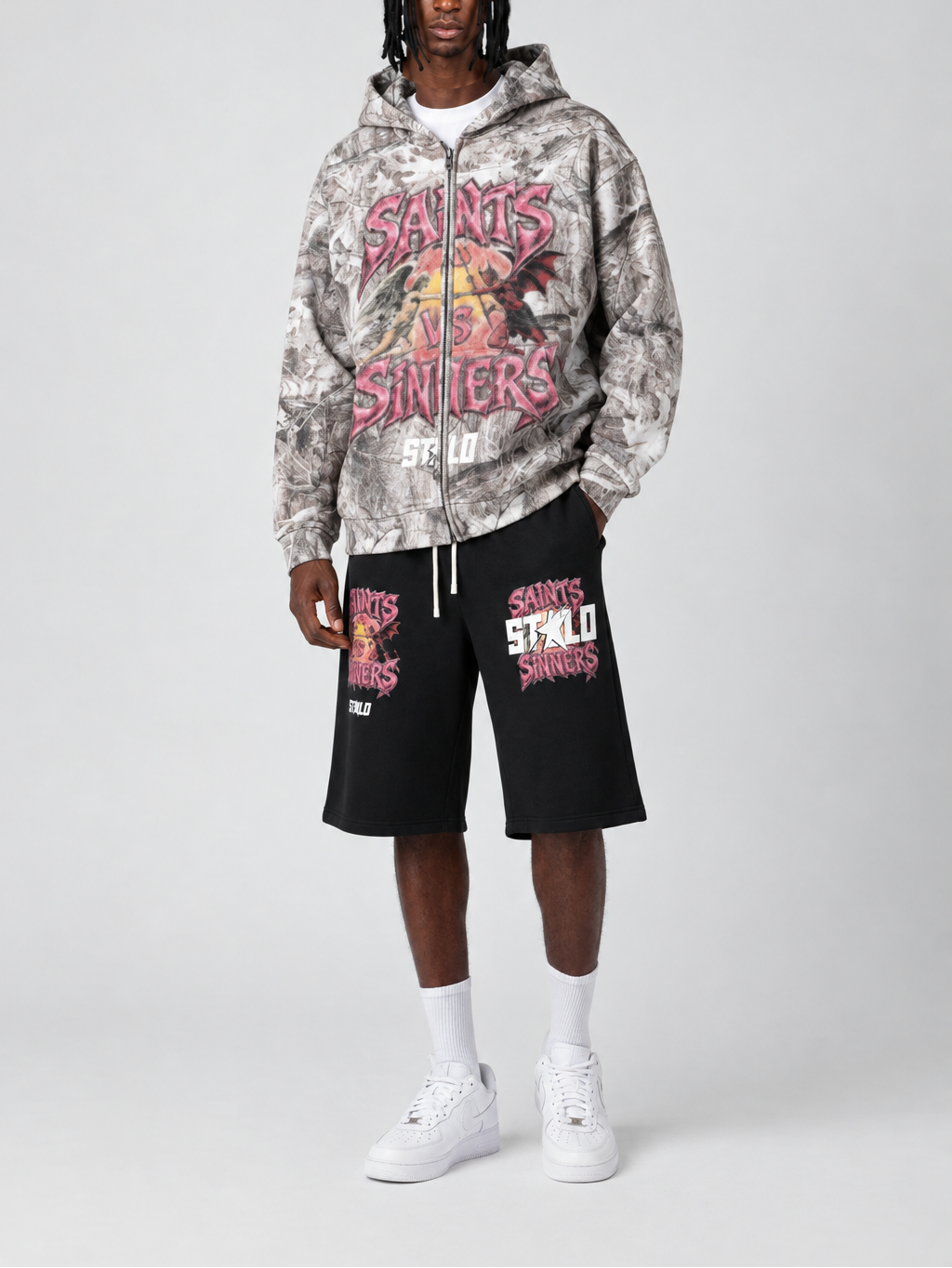 Model face reference applied to Saints and Sinners graphic shorts outfit
