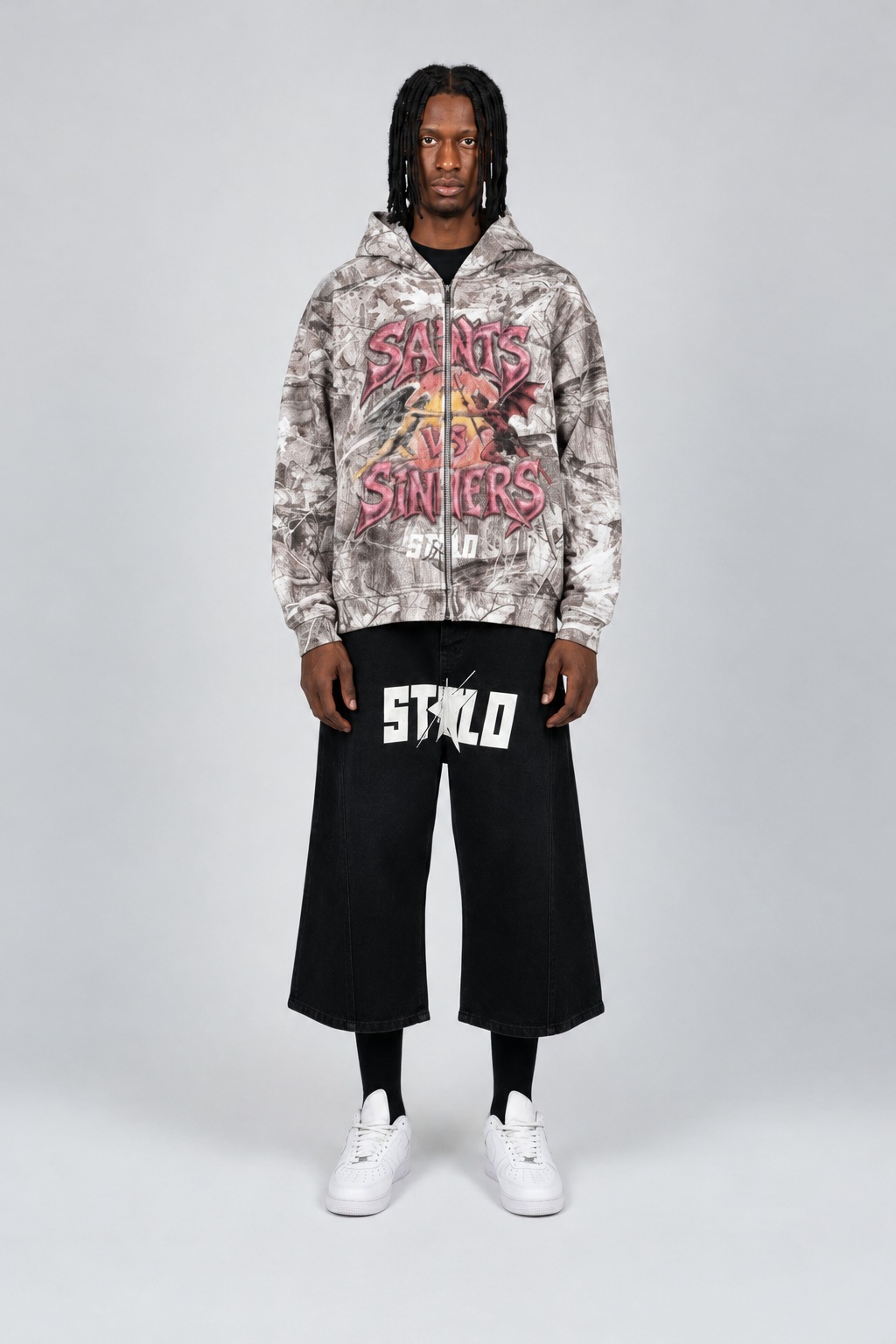 Model face reference applied to Saints and Sinners hoodie and STOLO shorts outfit