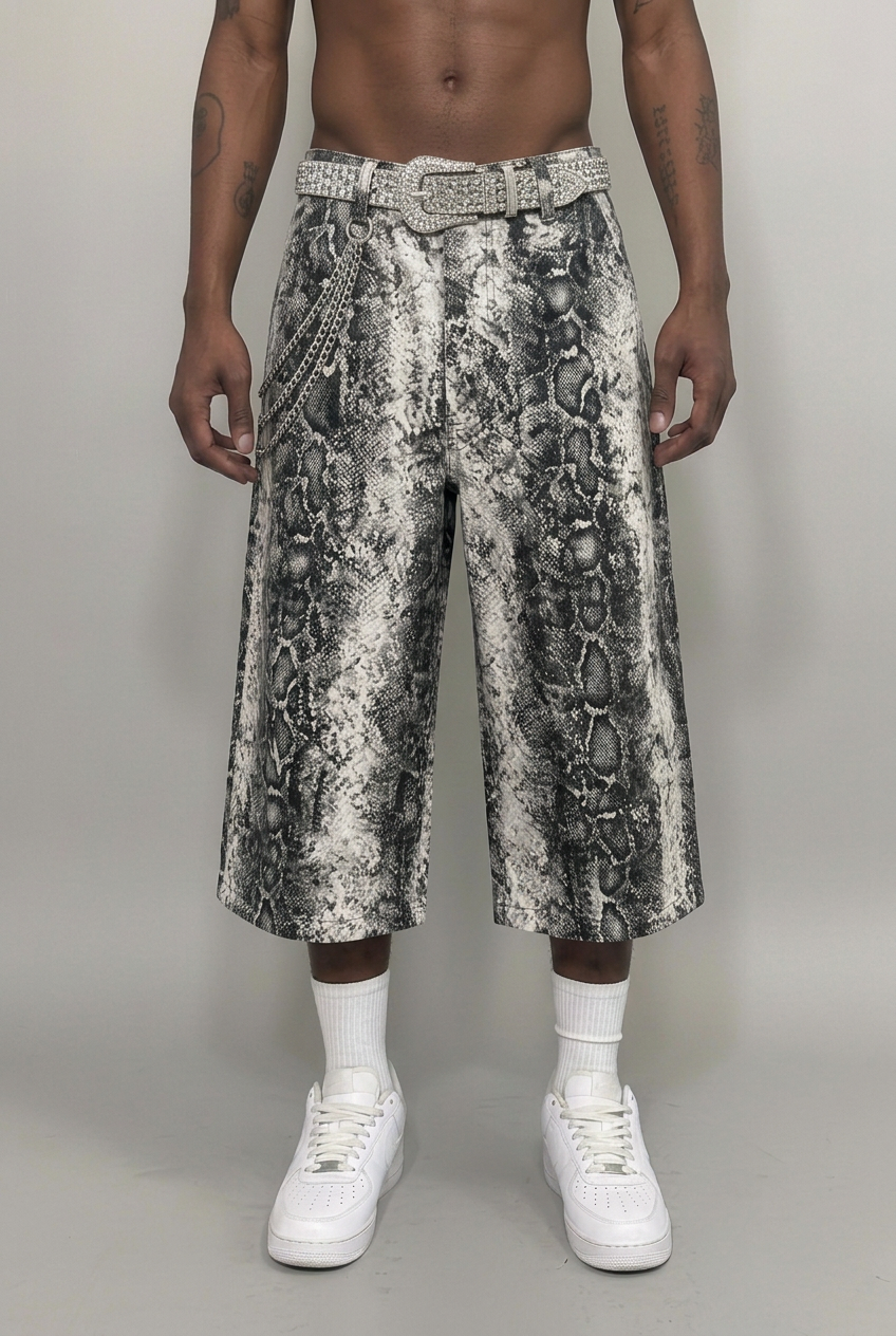 Model wearing snake-print jorts, front view