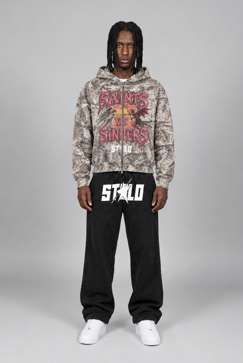 Natural phone-style front view of camo hoodie and black sweats
