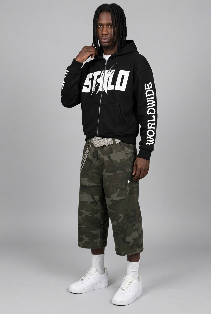 STOLO hoodie model in green camo shorts, three-quarter side pose