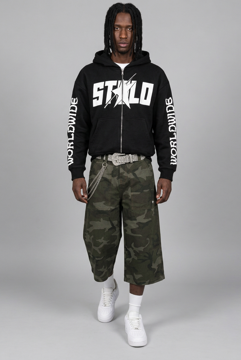 STOLO hoodie model walking in green camo shorts