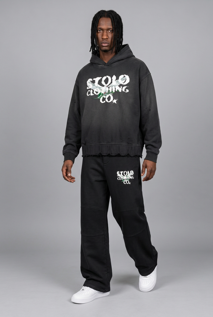 STOLO model wearing the black hoodie and matching pants in a new pose
