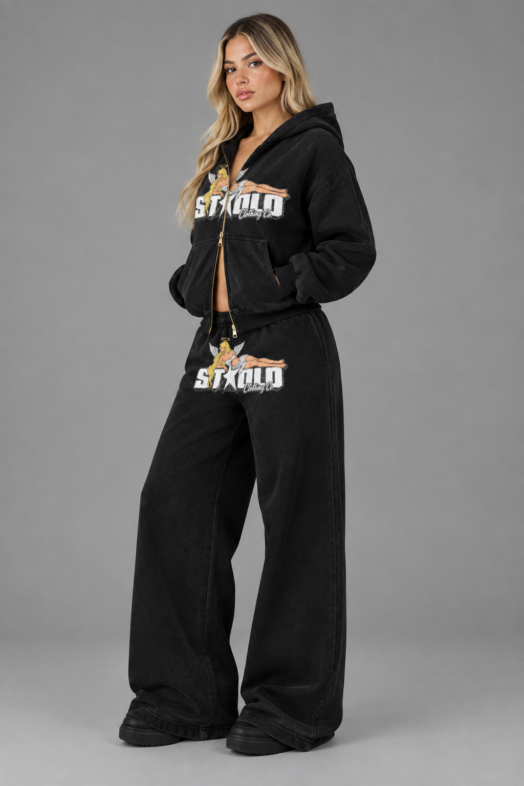Three-quarter studio image of the black hoodie and wide-leg pants set