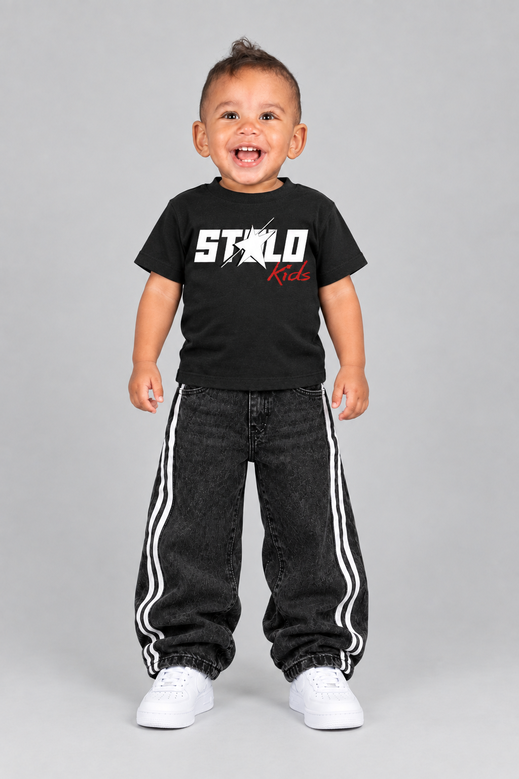 Updated front view with the toddler model’s white sneakers visible