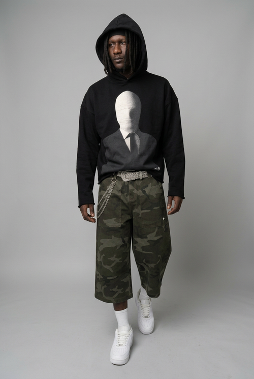 Walking pose with hoodie and camo shorts