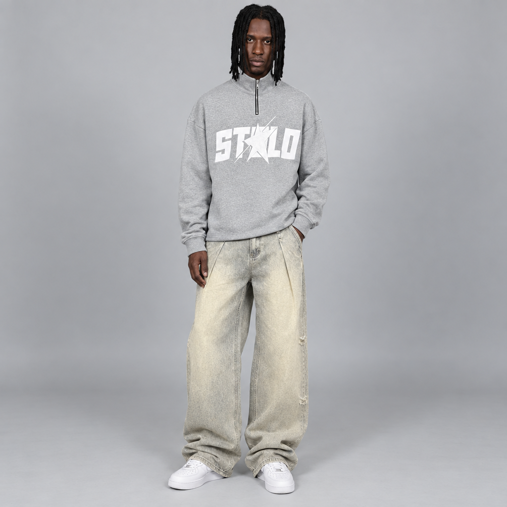 Your model in the gray quarter-zip and beige jeans